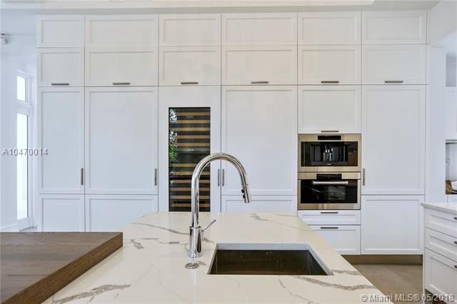Chef's kitchen with paneled appliances
